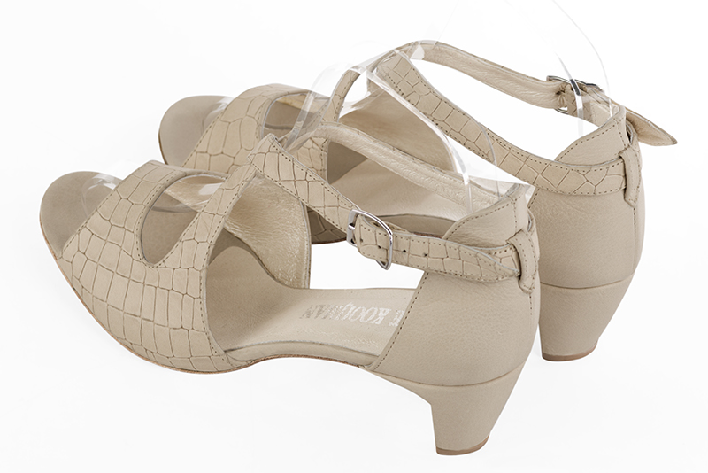 Champagne white women's closed back sandals, with crossed straps. Round toe. Low comma heels. Rear view - Florence KOOIJMAN